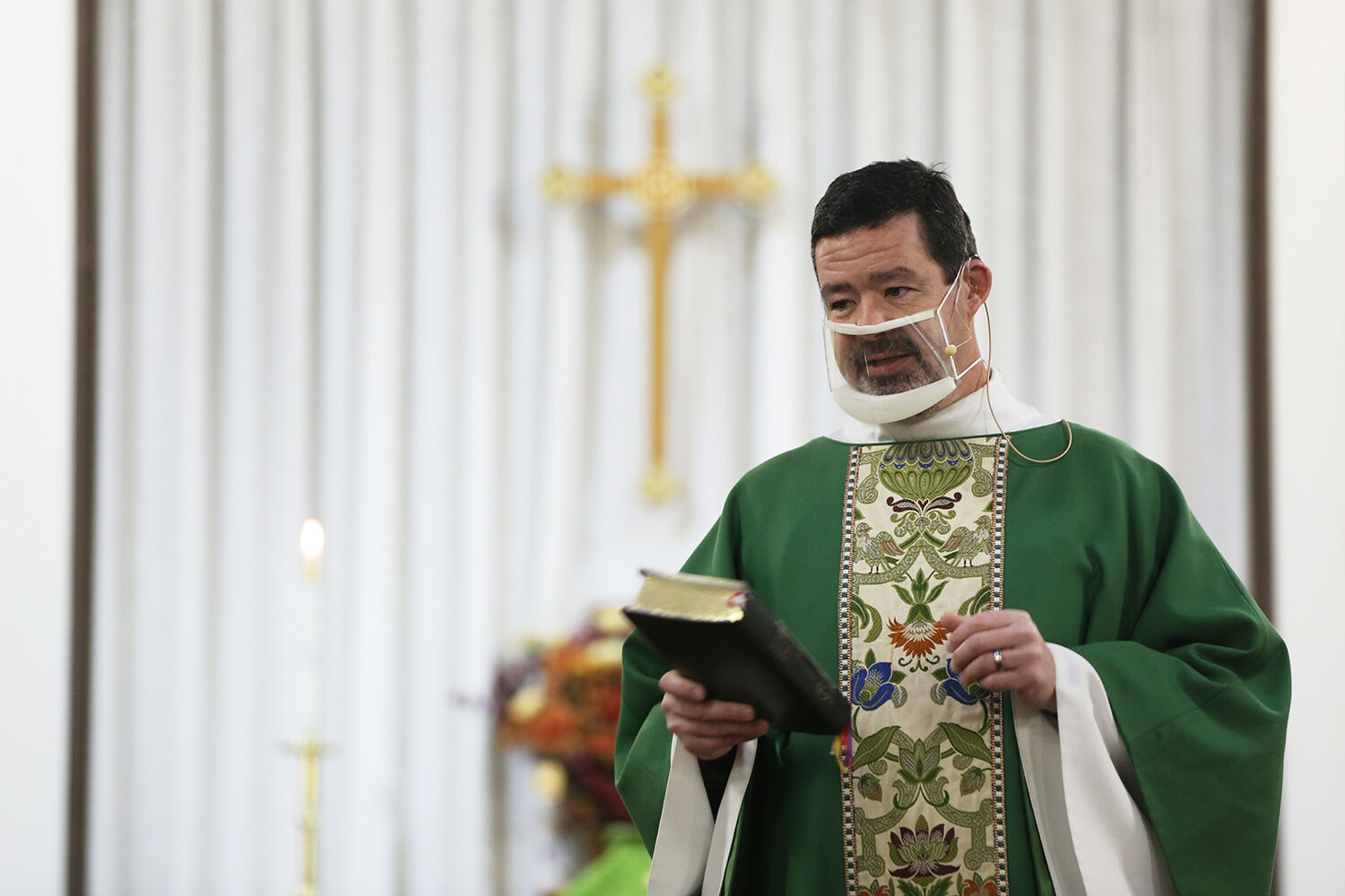Fr. Doug Wasinger kicks off the Sunday service with updates